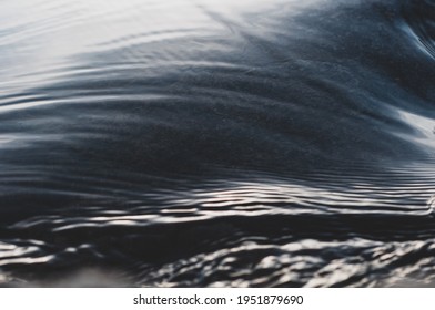 Fast flowing cold water mountain stream, flowing stream stream with flat smooth surface, nature outdoors, fresh stream dark blue water, clean environment - Powered by Shutterstock