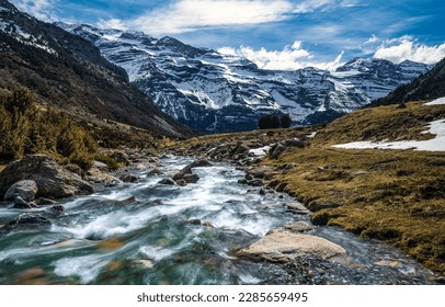 Fast flowing mountain river landscape. Snowy mountain river landscape. Mountain river in winter time. River in snowy mountains - Shutterstock ID 2285659495