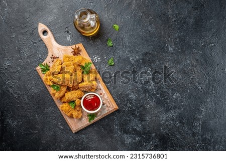 fast food chicken nuggets with ketchup on a wooden board, banner, menu, recipe place for text, top view,
