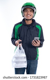 Fast Food Delivery. Man With Uniform Jacket And Helmet Delivering Food Isolated Over White