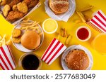 Fast food delivery menu background with various burgers, cheeseburger, nuggets, french fries, fizzy soda drinks. Junk unhealthy fast food, Ultra processed food with low nutrition, high calories value