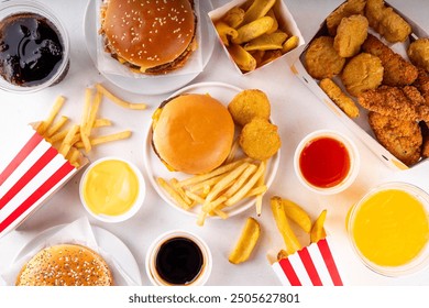 Fast food delivery menu background with various burgers, cheeseburger, nuggets, french fries, fizzy soda drinks. Junk unhealthy fast food, Ultra processed food with low nutrition, high calories value - Powered by Shutterstock