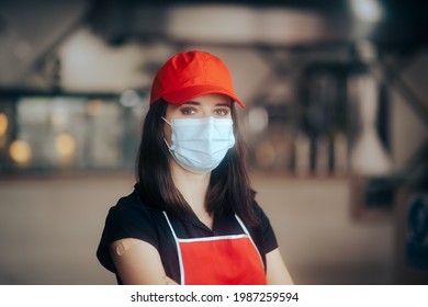 Fast Food Employee Wearing Face Mask Ready For Business Reopening. Female Employee In The Food Service Industry Back In Business After Vaccination
