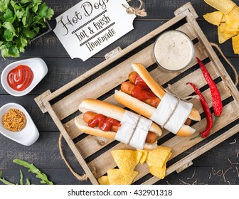 Fast Food Menu. Top View. Two Hot Dogs, Beer, Herbs And Chips On Wooden Tray. Rustic Style.