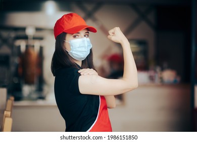 Fast Food Restaurant Worker Wearing Face Mask Showing Vaccinated Arm. Food Service Employee Feeling Strong After Anti Covid Immunization
