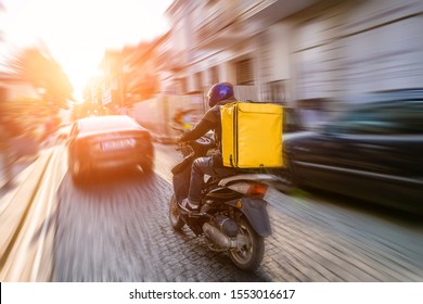 Fast And Free Delivery Food By Scooter In The Afternoon In The City 