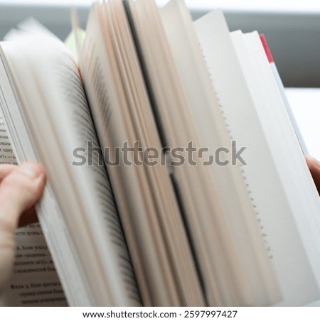 fast leafing through a book
