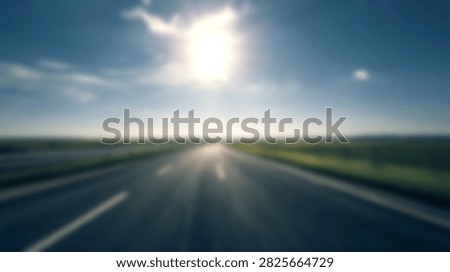 A fast motion blur perspective of an empty highway stretching towards the bright sun under a clear blue sky