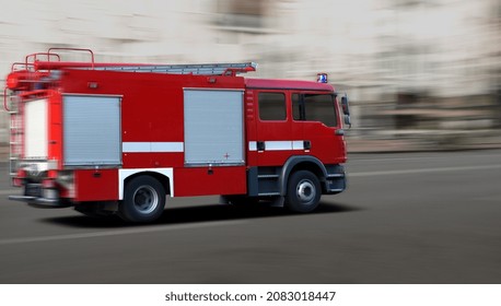 Fast Movement Of A Fire Truck Along A City Street