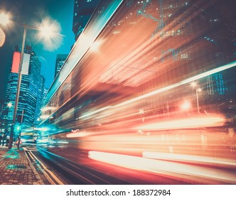 Fast Moving Cars At Night In Modern City
