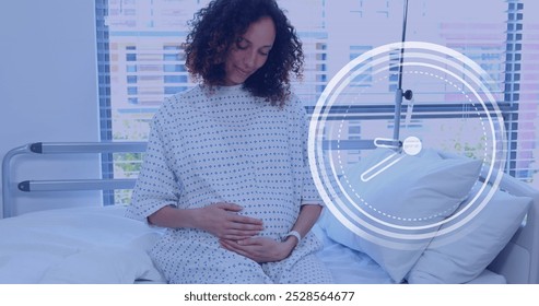 Fast moving clock over happy pregnant biracial woman rubbing belly in hospital room. Pregnancy, healthcare, expectancy, time, development, motherhood and medical services digitally generated image. - Powered by Shutterstock