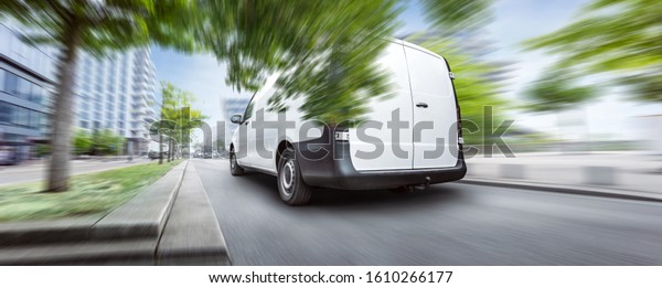 Fast moving delivery\
van inside a city