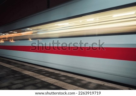 fast moving train in the evening whose speed is shown by motion blur 