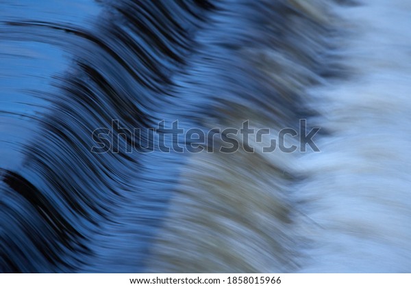 fast-moving-water-close-on-weir-stock-photo-1858015966-shutterstock