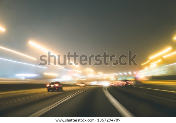 Fast
night driving on highway, view from inside of a
car