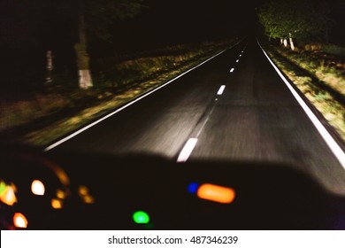 Fast night driving, view from inside of a car 