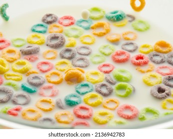 Fast Nutritious Breakfast - Colored Fruit Whole Grain Rings In Milk. Baby Food, Diet, Fitness. Sweet Food. Vitamins, Minerals, Fiber. Supermarket, Advertising. There Are No People In The Photo.