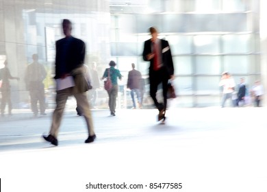 Fast Paced Business World With Blurred Motion. People Walking. All Exposed Faces Are Motion Blurred.
