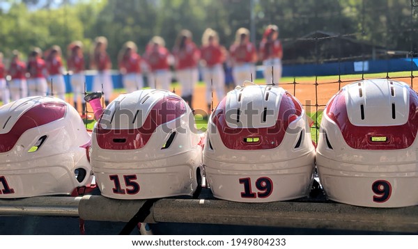 Fast\
Pitch Softball helmets with the girls on the\
field.