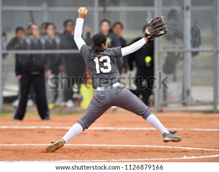 Fast Pitch Softball Pitcher Throwing a Strike