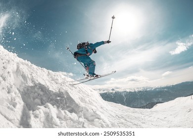 Fast and professional skier jumps at big speed from snowdrift high in mountains - Powered by Shutterstock