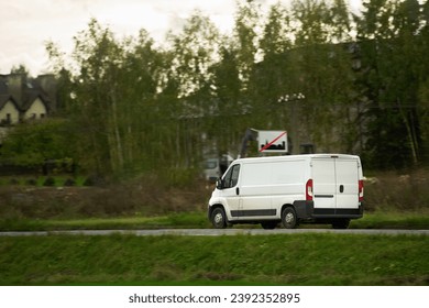 A fast and reliable delivery service with a commercial van on the road. Delivery truck on the highway road. Courier shipping truck.