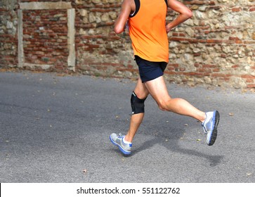 Fast Runner Running Fast With A Knee Brace To Support Muscle Ligaments