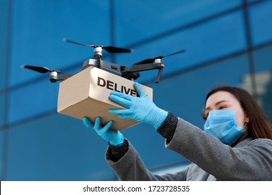 Fast And Safe Delivery. Drone Delivering Brown Post Package To Woman Doctor, Coronavirus, Quarantine, Contactless Delivery