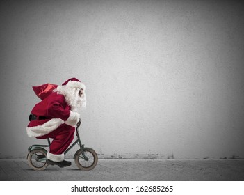 Fast Santa Claus on a small bike