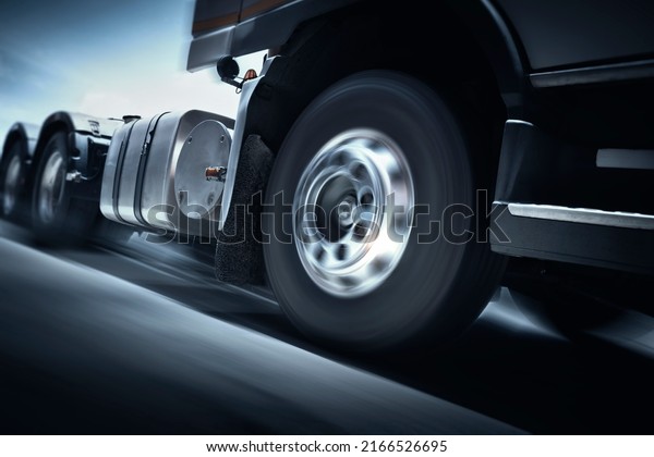 Fast\
Spinning Truck Wheels. Semi Truck Driving on the Road  Shipping\
Freight Truck. Logistics Cargo Transport\
Logistics.