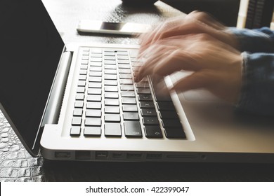 Fast Typing Woman On Laptop. Blurred Hands Typing