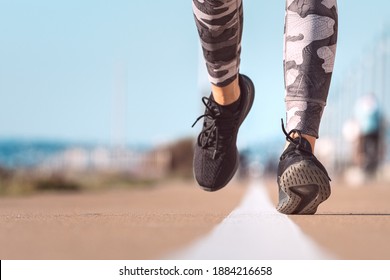 Fast Walking. Fit Woman Runner Jogging. Close Up Of Running Shoes In Action