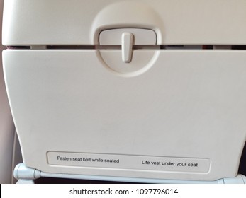 Fasten Seat Belt Sign On Food Tray Back Of Seat On Air Plane 