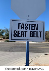 Fasten Seat Belt Sign On Back Of Stop Sign Post