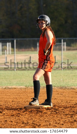a fastpitch softball player on second base