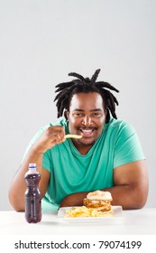 Fat African American Man Eating Chips