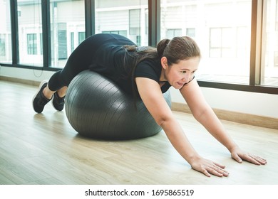 Fat Asian women exercise in fitness. With a yoga ball. Health concept, weight loss, healthy body - Shutterstock ID 1695865519
