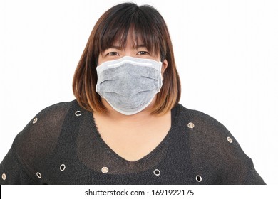 Fat Asian Women Wear Masks To Protect Against Coronavirus. Obesity Health Concept. White Background