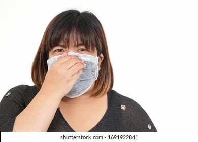 Fat Asian Women Wear Masks To Protect Against Coronavirus. Obesity Health Concept. White Background