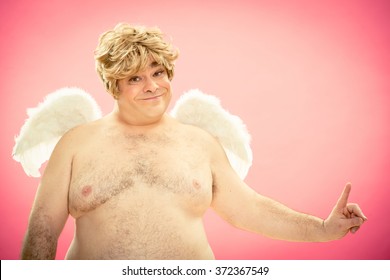 Fat Blonde Cupid Angel Point An Idea Portrait On Pink