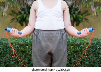 Fat Boy Hand Hold Jump Rope For Workout Selective Focus,with Copy Space,healthcare Concept.