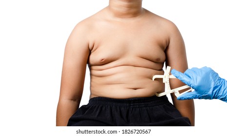 Fat boy with measuring caliper isolated on white background.healthy concept.