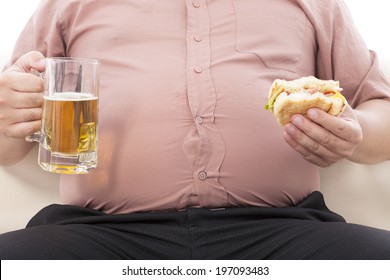 Fat Business Man Holding Beer Mug And Hamburger