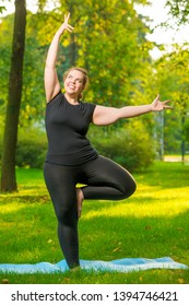 Fat Cheerful Woman Doing Yoga In The Park, Plus Size Model