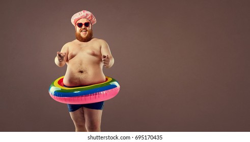 Fat funny man in an inflatable ring.