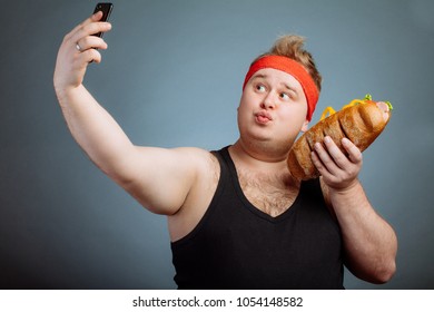 Fat Funny Man With Sandwich In Hand Makes Selfie