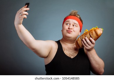 Fat Funny Man With Sandwich In Hand Makes Selfie