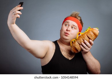 Fat Funny Man With Sandwich In Hand Makes Selfie