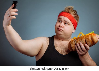 Fat Funny Man With Sandwich In Hand Makes Selfie