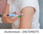 fat girl injects the drug Ozempic into her arm for weight loss at home. Weight loss and treatment without sports